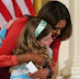 Girl Hands Michelle Obama Resume of Unemployed Dad