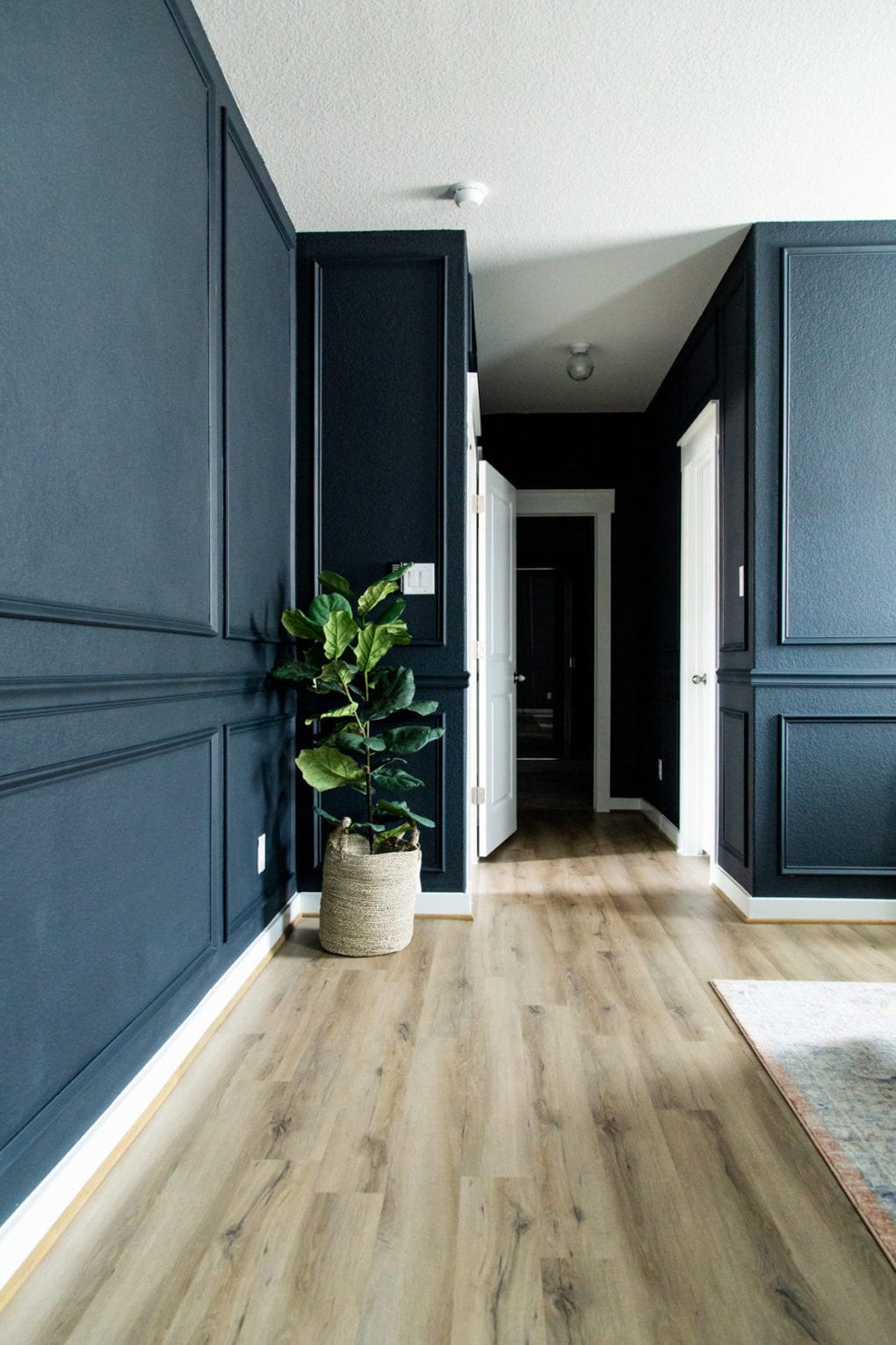 Ink Black walls with picture molding