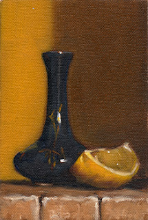 Oil painting of a small blue porcelain vase beside a lemon quarter.