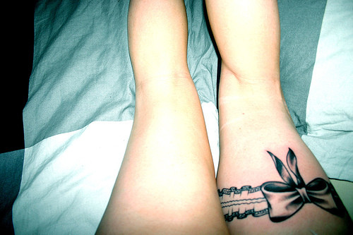tattoos on legs for women. bows tattoos pink ribbon