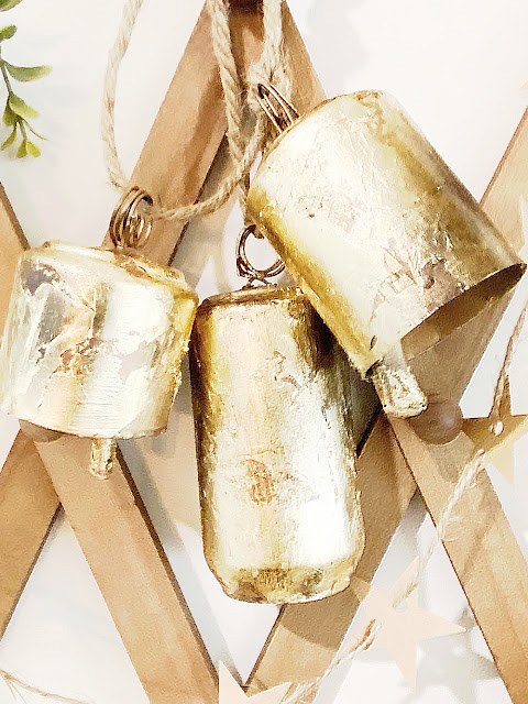 gold leafed bells made from soda cans