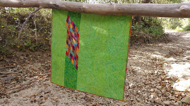 Scrappy Lonestar quilt using Empress Garden fabrics by Island Batik