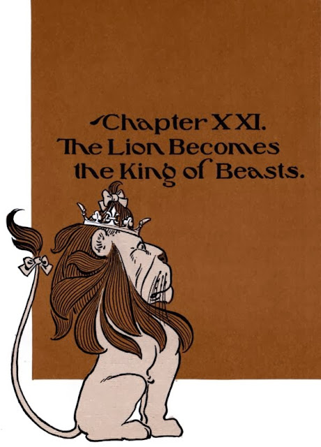 The Lion sits regally with a crown on his head on the title page for "Chapter XXI. The Lion Becomes the King of Beasts."