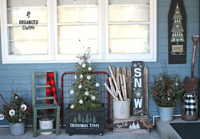 A Painted & Stenciled Crate In A Rustic Outdoor Christmas Display