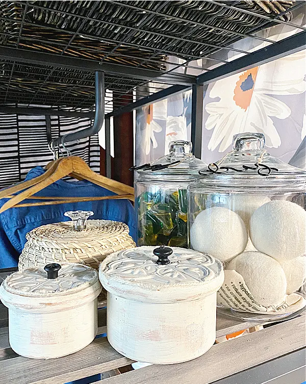 tin ceiling boxes on laundry room shelves