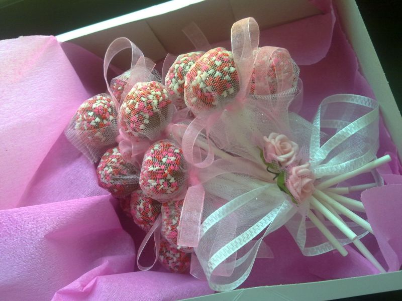  Decorated Cake Pops tied with a beautiful ribbon surrounded by tissue