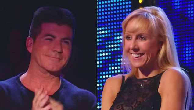 Cowell standing while giving Graham a round of applause.