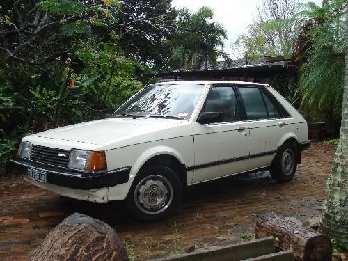 The old white mazda 1. One of the most reliable cars on the road ))