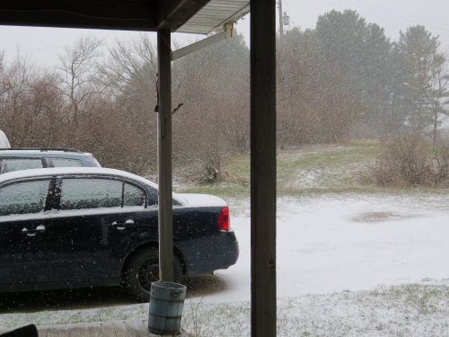 snow on the ground and cars