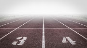 Empty running track and shrouded by fog