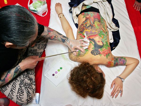 One of Japan's top tattoo artists creates traditional Japanese art on a 