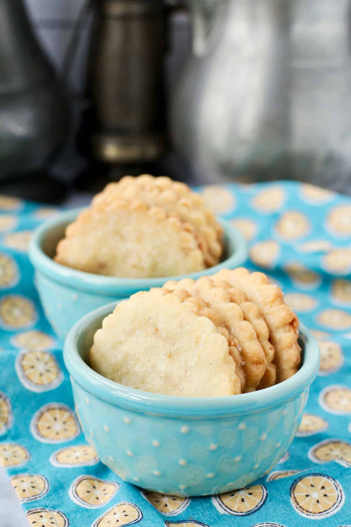 Buttery Ginger Shortbread Cookies in blue bowls.