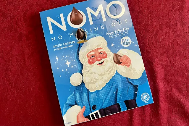 NOMO chocolate advent calendar with a window open to show the chocolate drop