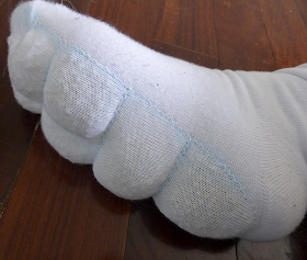 Completed sock being worn