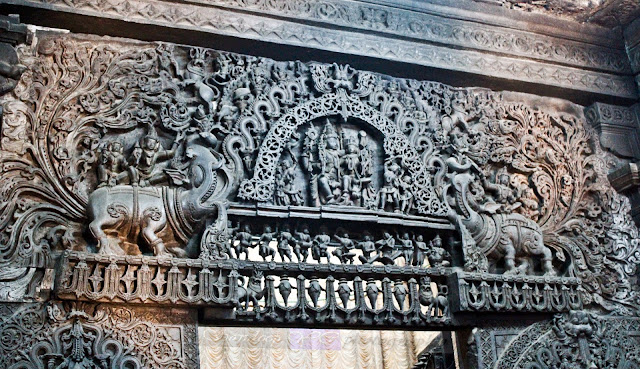 The intricately carved doorjamb of the Garbhagriha