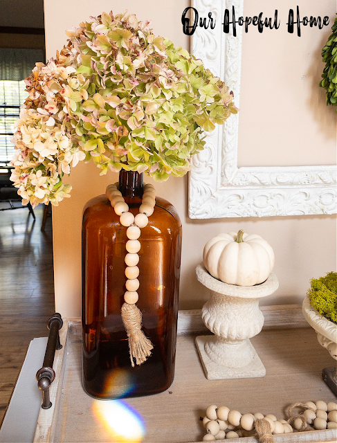 amber bottle dried hydrangea wood bead garland