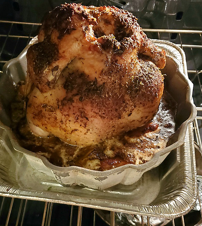 this is a chicken made in a bundt pan with vegetables around it