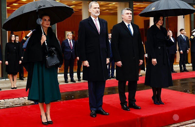 Queen Letizia wore a navy blue off-shoulders diamante midi dress by Bouret. First Lady Sanja Music Milanovic