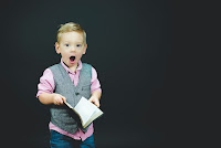 Boy Surprised by Bible - Photo by Ben White on Unsplash