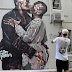 Did Kanye West pay $100k to have the painting of his mural kissing himself painted over?