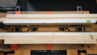 Portable work bench with dowels running between the swivel pegs on each halves to create a space big enough to put an enclosure.