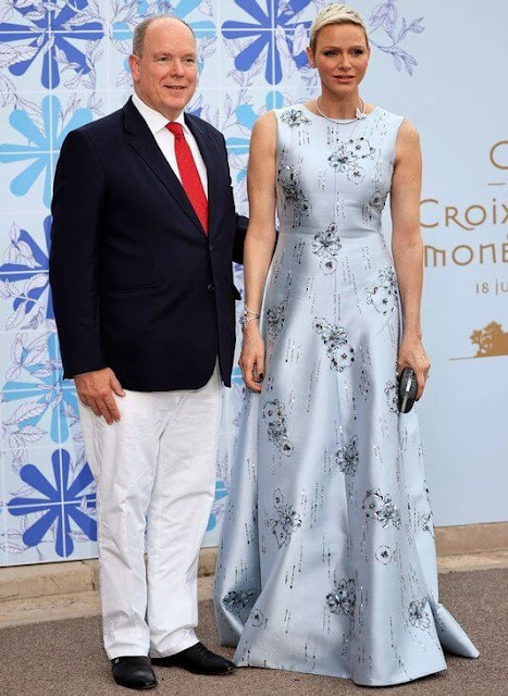 Princess Charlene wore a light blue embroidered gown by Prada. Van Cleef & Arpels Envol butterfly necklace