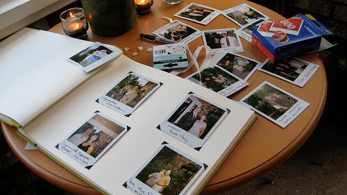 Make your guest book table interactive and fun by setting up a Polaroid 