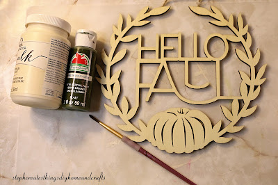 Acrylic paint, paintbrush and unpainted hello fall sign