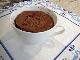 Microwaved blueberry muffin in a  mug