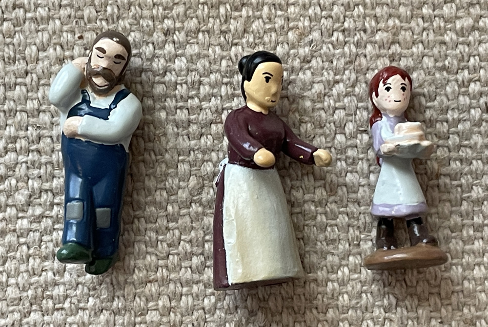 Closer view of the Matthew Cuthbert, Marilla Cuthbert, and Anne Shirley characters in the Anne of Green Gables miniature diorama