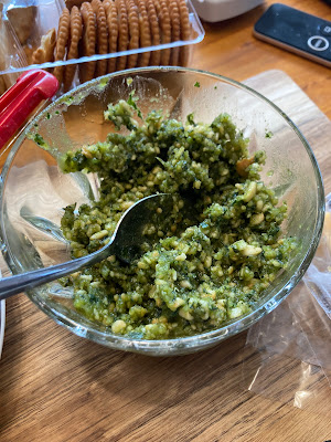 Homegrown basil pesto in a dish.