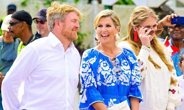 Queen Maxima wore an ocean dress by Foberini. Princess Amalia wore Heidi floral pattern blouse by Fabienne Chapot