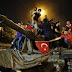 Turkish riot police escort a soldier, center, who allegedly took part in a military coup in Istanbul