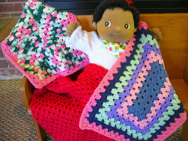 Granny square crocheted lovey for an Operation Christmas Child shoebox.