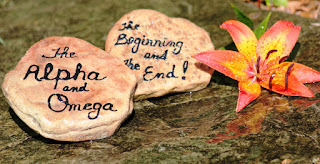 Alpha and Omega written on stones