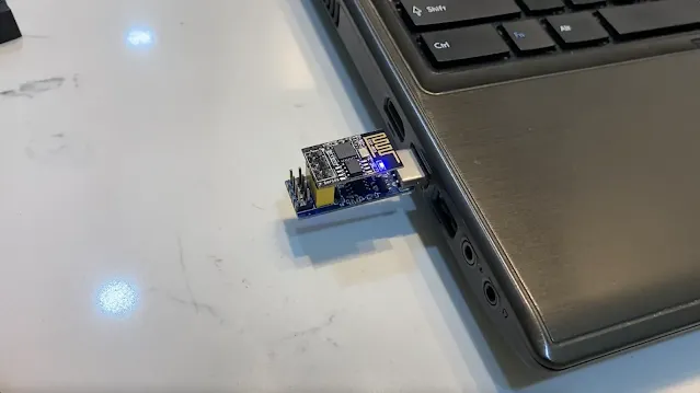A ESP-01S plug into USB Programmer and connect to computer.
