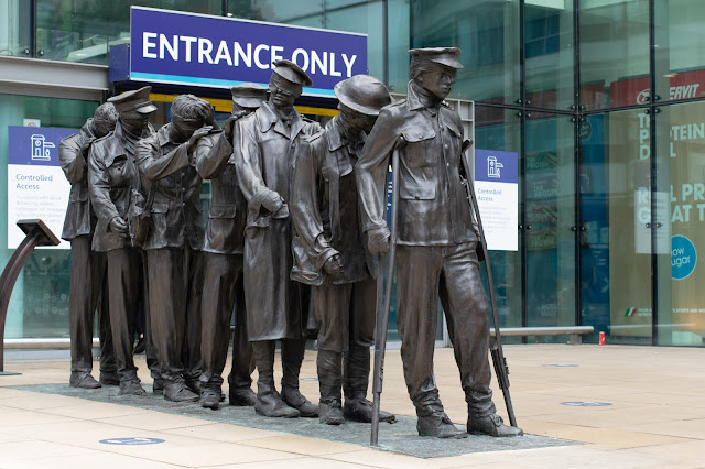 bronze statue of blind World War One soldiers walking in a line