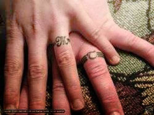 These Best art wedding ring tattoo designs range from inked patterns around