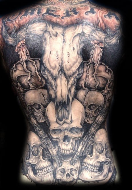 Great animal skull with guns and skulls tattoo on whole back