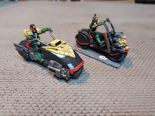 Two Judge Dredd Lawmasters, old and new