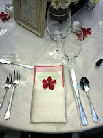 Red and white wedding table place setting - Photo by Patricia Stimac, Seattle Wedding Officiant