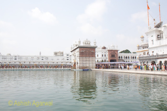 View of the Darshani Deori and caueway full of devotees inside the Golden Temple