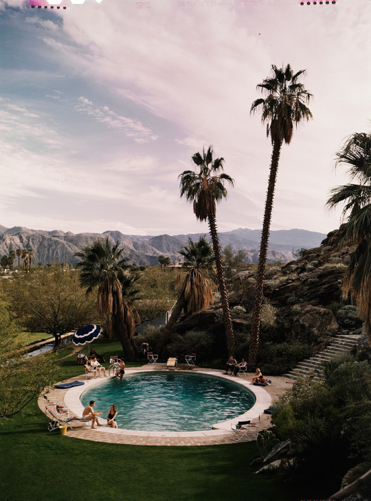 A wealthy group of young people relax by a pool in California, 1940. Photograph by J. Baylor Roberts, National Geographic