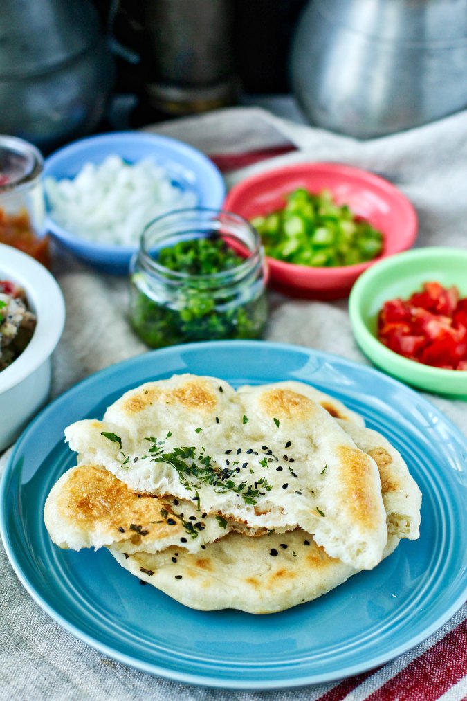 Matar Kulcha (or Chole Kulcha) with all of the salsas in the background.