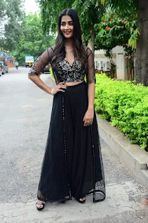 Actress Pooja Hegde Stills in black dress at Valmiki movie Press Meet