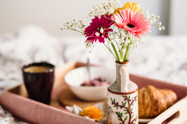 breakfast tray on bed:Photo by freestocks on Unsplash