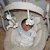Newborn Baby Sleeping In Swing