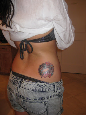 (Coy fish Yin yang tattoo, done at Miami Ink)