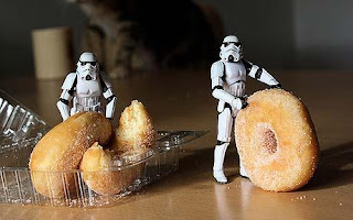 Star Wars Stormtroopers eating donuts.