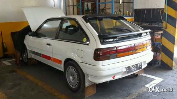 DIJUAL FORD  LASER  2 PINTU  LANGKA DENPASAR LAPAK MOBIL 